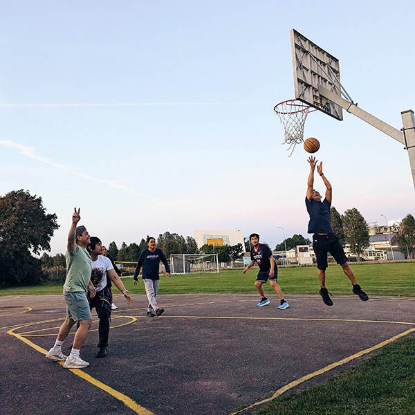 A group of seafarers playing basketball