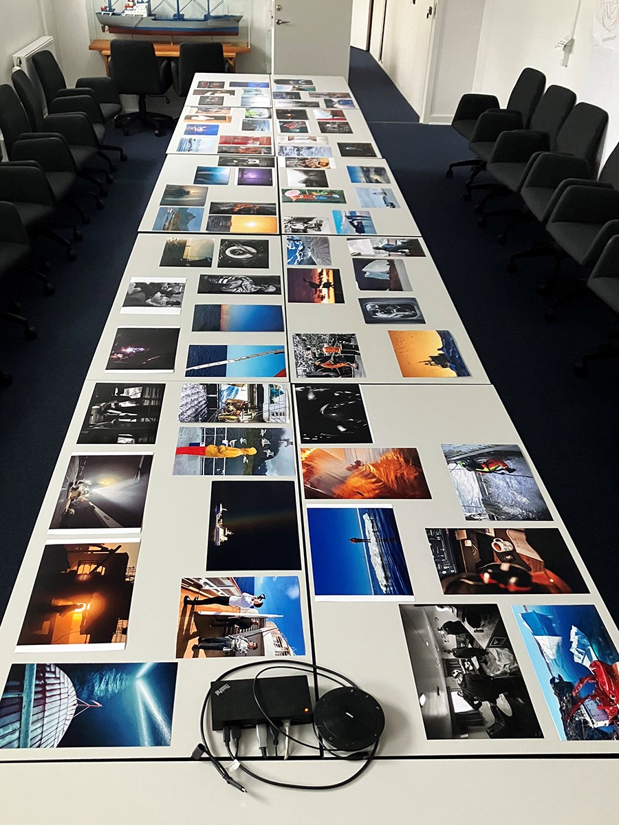 Photographs laid out on a white table